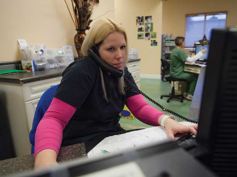 Client service representatives can ask clients specific questions about the patient and schedule call-backs for veterinarians or technicians. Photo © iStock / Getty Images Plus/DenGuy/470003221