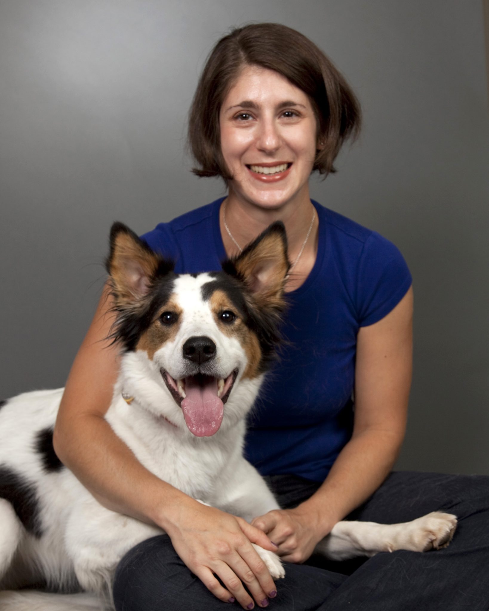 Smiling woman with happy dog.